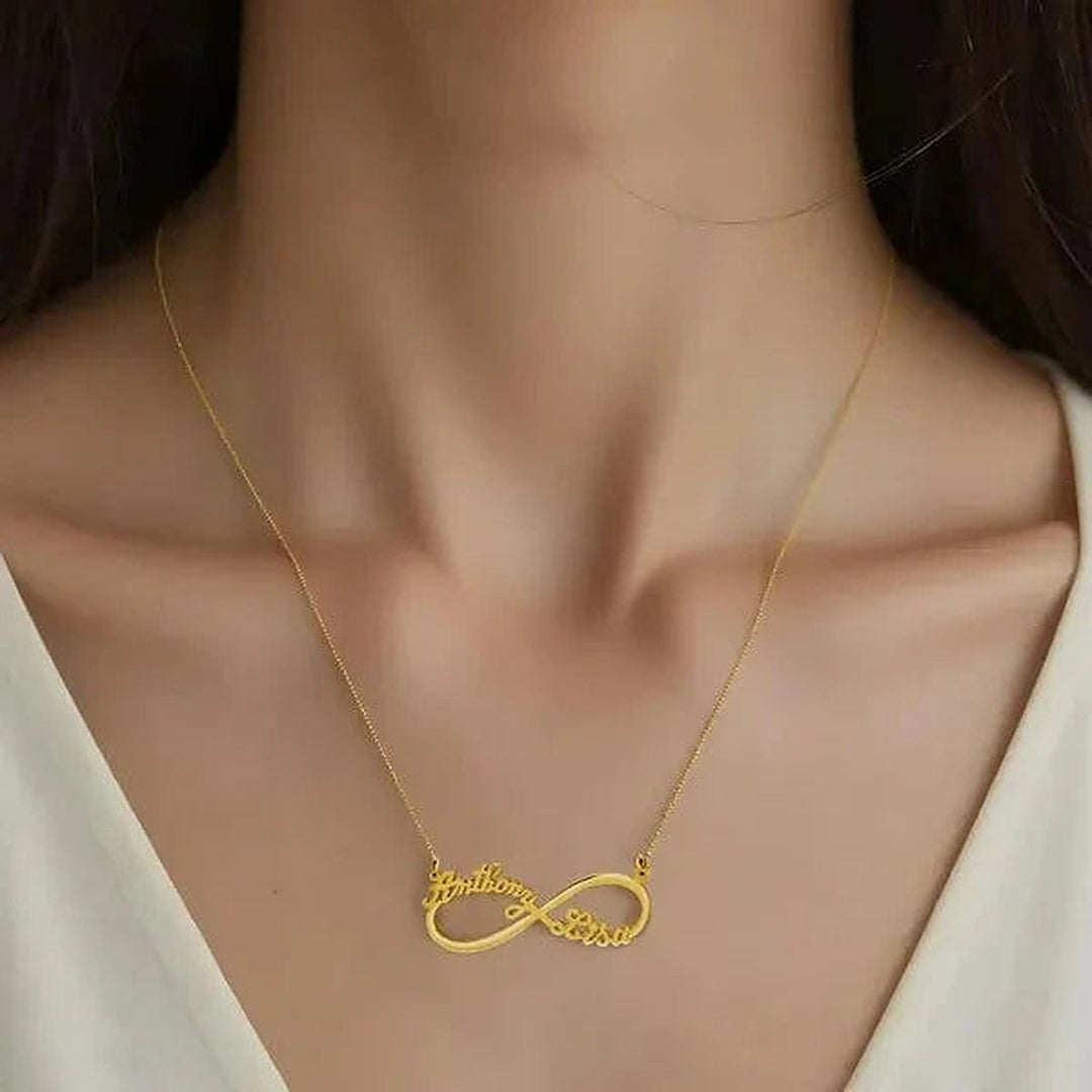 Model wearing the 14 Karat Two Name Infinity Name Necklace in 14K yellow gold personalized with the name Anthony | AJ's Jewelry