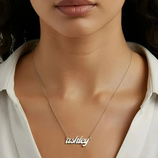 Model wearing a 14 Karat bold letter white gold name necklace
