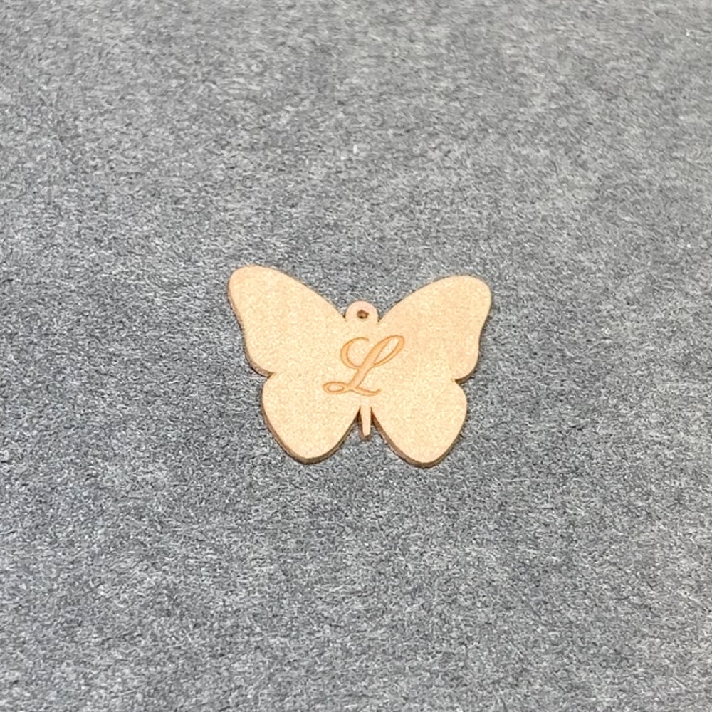 14kt yellow gold butterfly pendant after laser engraving and cutting — before hand finishing at AJ's Jewelry Queens NY
