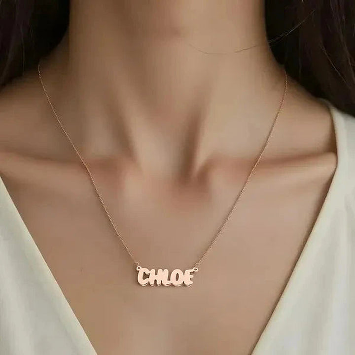 Model wearing the 14 Karat Bubble Letter Name Necklace in 14K rose gold personalized with the name Chloe | AJ's Jewelry