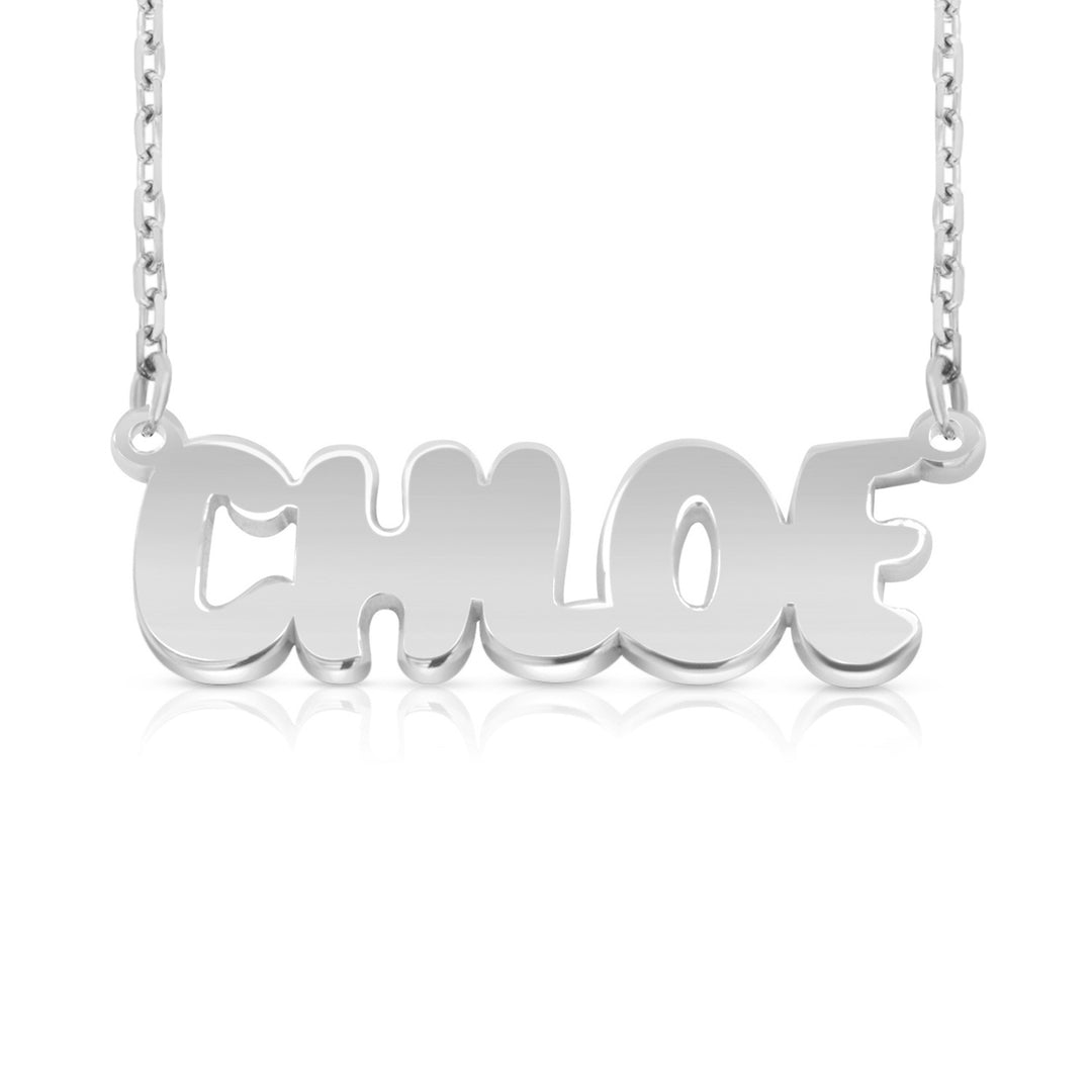 A silver nameplate necklace spelling 'CHLOE' in a bold, rounded font, suspended from a delicate silver chain against a clean white background with a soft reflection below.  This photo can change appearance depending on the name input using the custom name builder