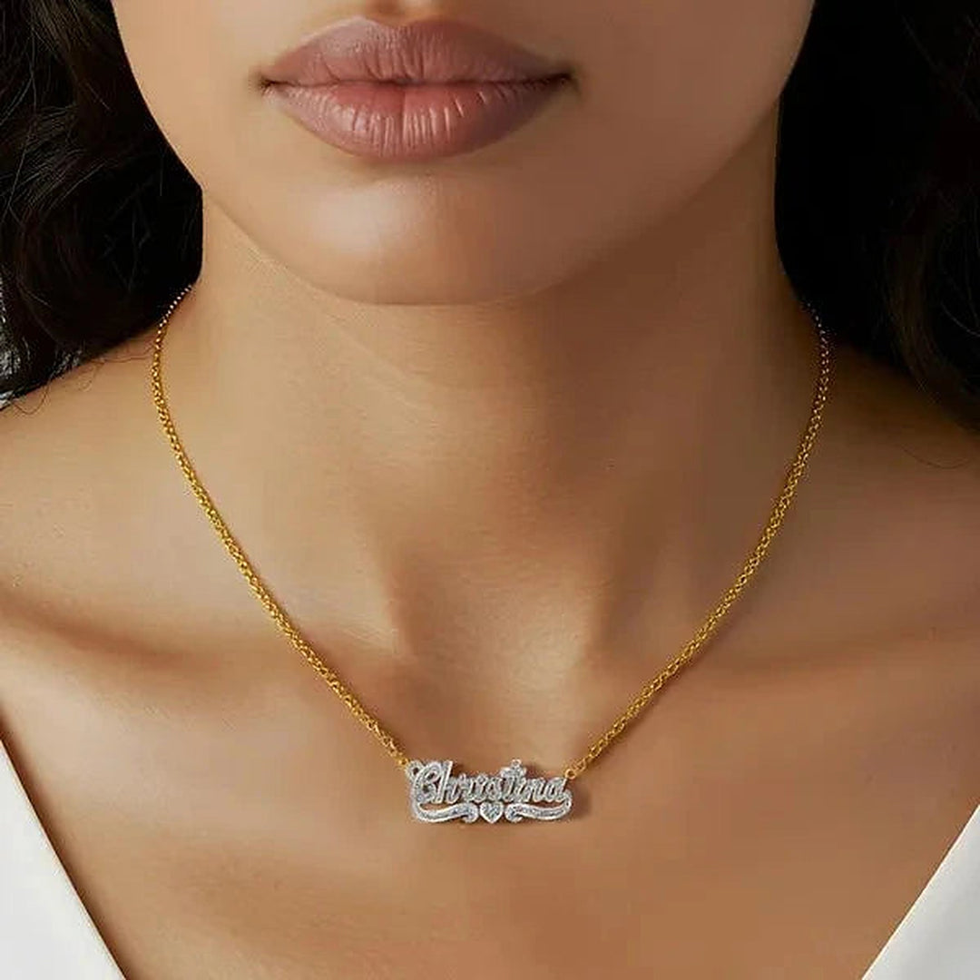 Model wearing the 14 Karat Diamond Cut 3D Name Necklace with One Heart in 14K yellow gold, name Christina | AJ's Jewelry
