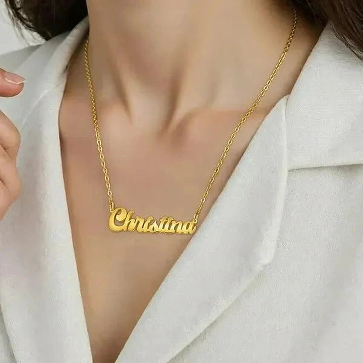 Model wearing the 14 Karat Solid Letter Name Necklace in 14K yellow gold personalized with the name Christina | AJ's Jewelry