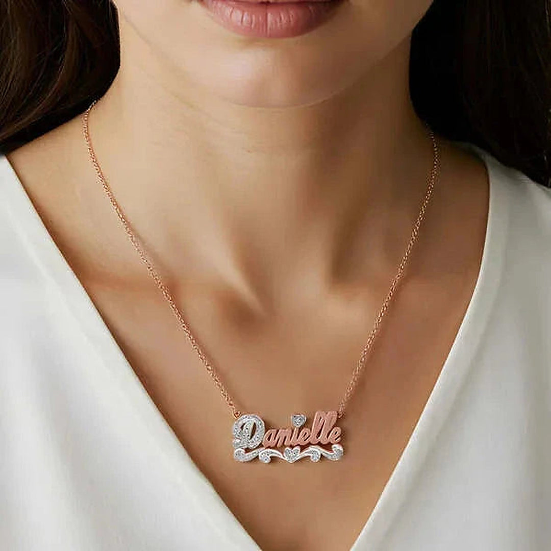 Model wearing the 14 Karat Polished and Diamond Cut 3D Name Necklace in 14K rose gold, name Danielle | AJ's Jewelry