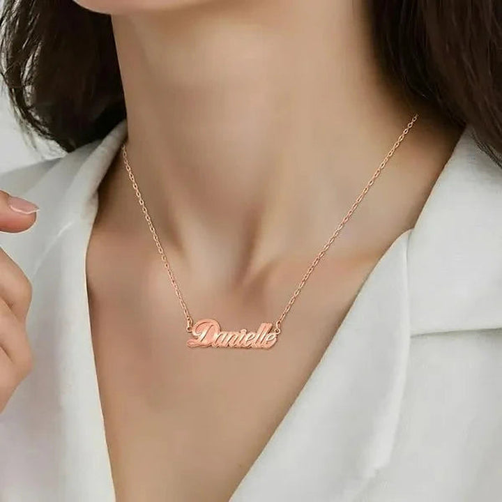 Model wearing the 14 Karat Fancy Script Name Necklace in 14K rose gold personalized with the name Danielle | AJ's Jewelry