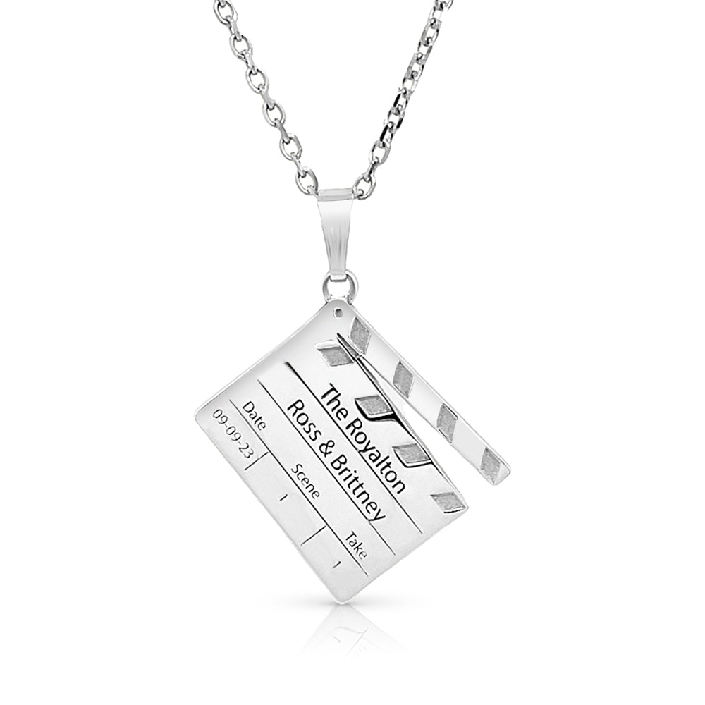 Completed 14kt white gold personalized director's clapperboard pendant engraved with names date and venue by AJ's Jewelry in Ridgewood Queens NY