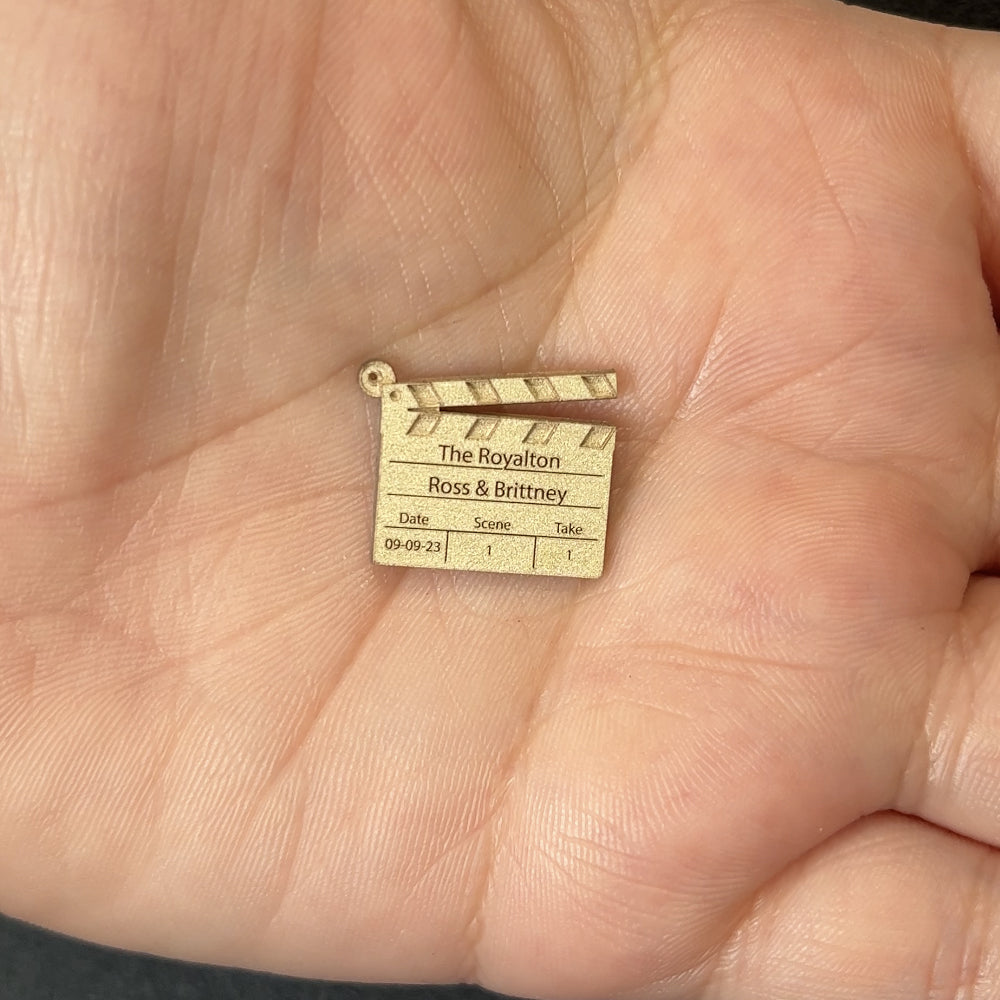 14kt white gold director's clapperboard pendant after laser engraving and cutting, before hand finishing at AJ's Jewelry Queens NY