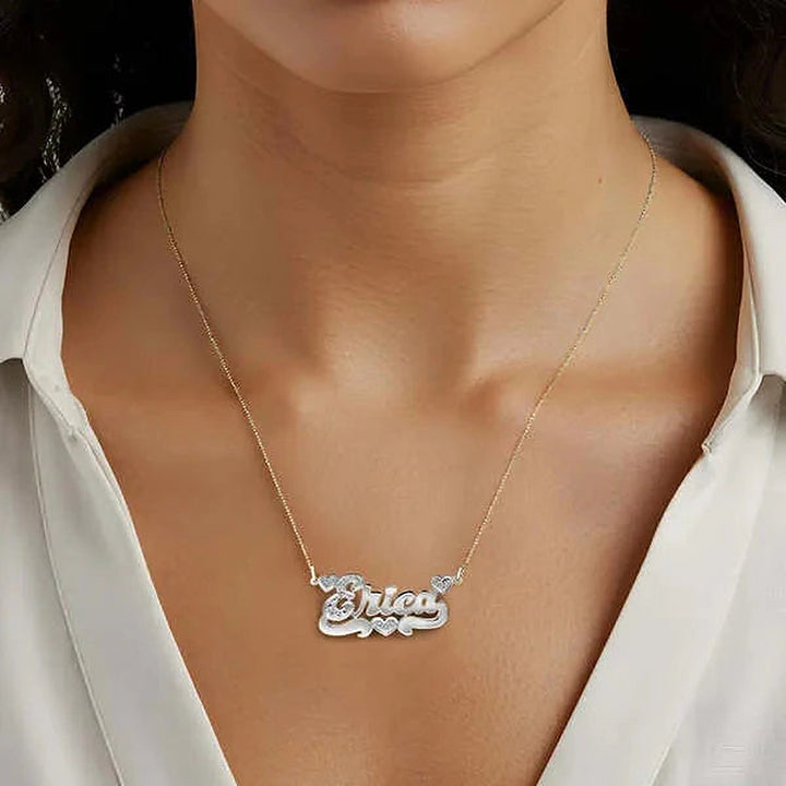 Model wearing the 14 Karat Polished and Diamond Cut 3D Name Necklace with Three Hearts in 14K white gold, name Erica | AJ's Jewelry