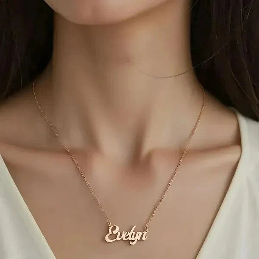 Model wearing the 14 Karat Solid Letter Name Necklace in 14K rose gold personalized with the name Evelyn | AJ's Jewelry