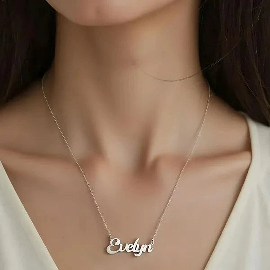 Model wearing the Sterling Silver Solid Letter Name Necklace personalized with the name Evelyn | AJ's Jewelry