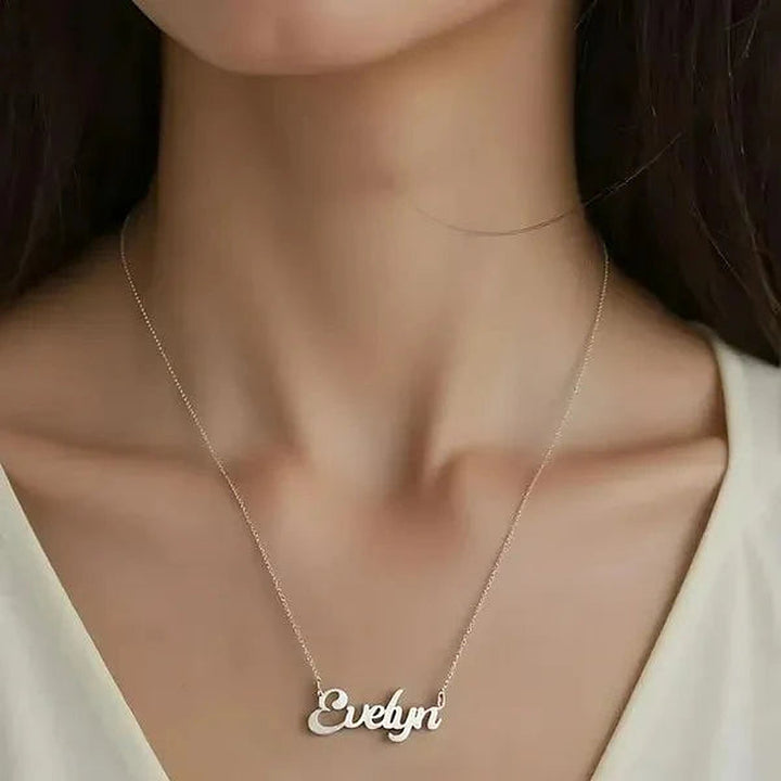 Model wearing the 14 Karat Solid Letter Name Necklace in 14K white gold personalized with the name Evelyn | AJ's Jewelry