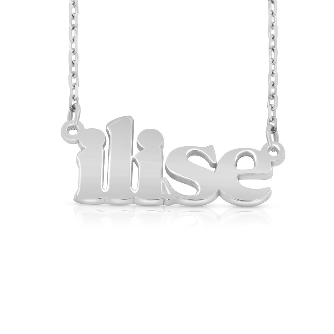 A silver nameplate necklace spelling 'ilise', hanging from a delicate silver chain against a white background.  This photo can change appearance depending on the name input using the custom name builder