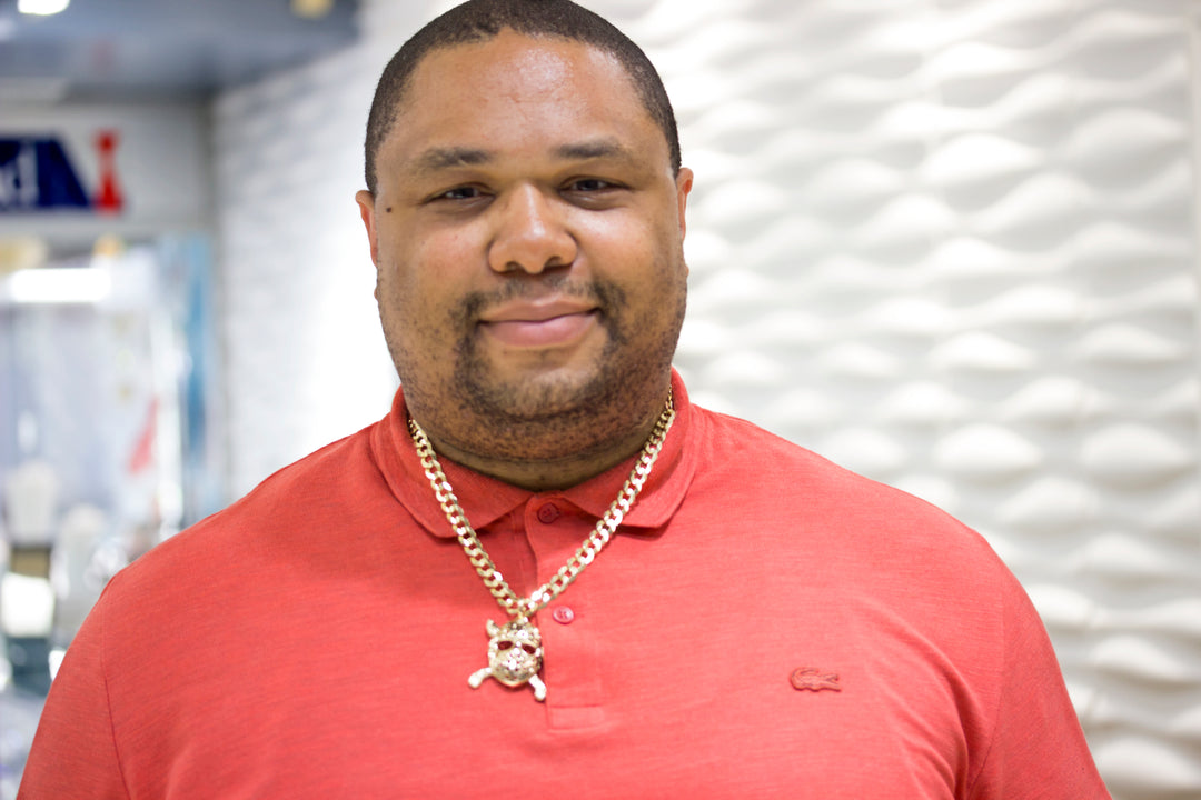 Happy AJ's Jewelry client wearing his finished 14kt yellow gold Jason hockey mask pendant — Ridgewood Queens NY