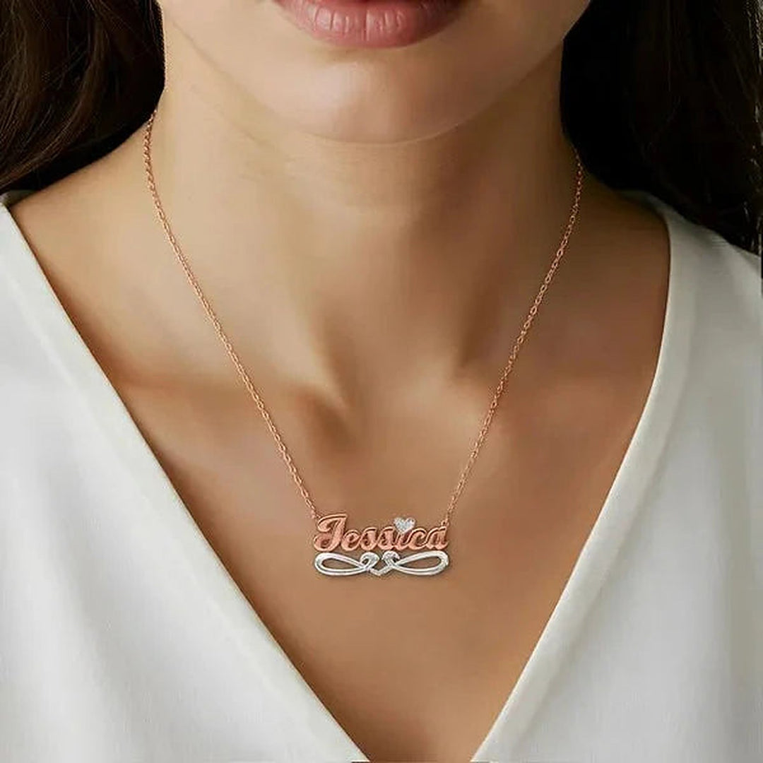 Model wearing the 14 Karat Bold Script Name Necklace with Tail in 14K rose gold personalized with the name Jessica | AJ's Jewelry