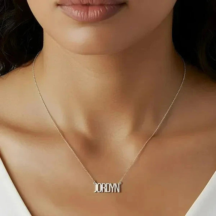 Model wearing the Sterling Silver Thin Letter Name Necklace personalized with the name Jordyn | AJ's Jewelry