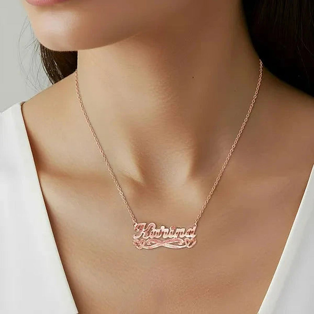 Model wearing the 14 Karat Diamond Cut & Florentine Name Necklace with Hearts in 14K rose gold, name Karina | AJ's Jewelry