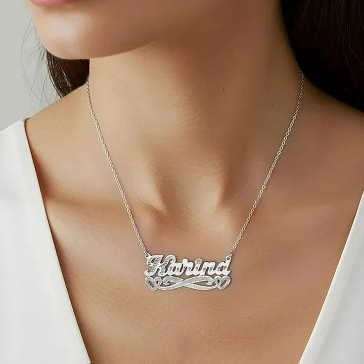 Model wearing the 14 Karat Diamond Cut & Florentine Name Necklace with Hearts in 14K white gold, name Karina | AJ's Jewelry