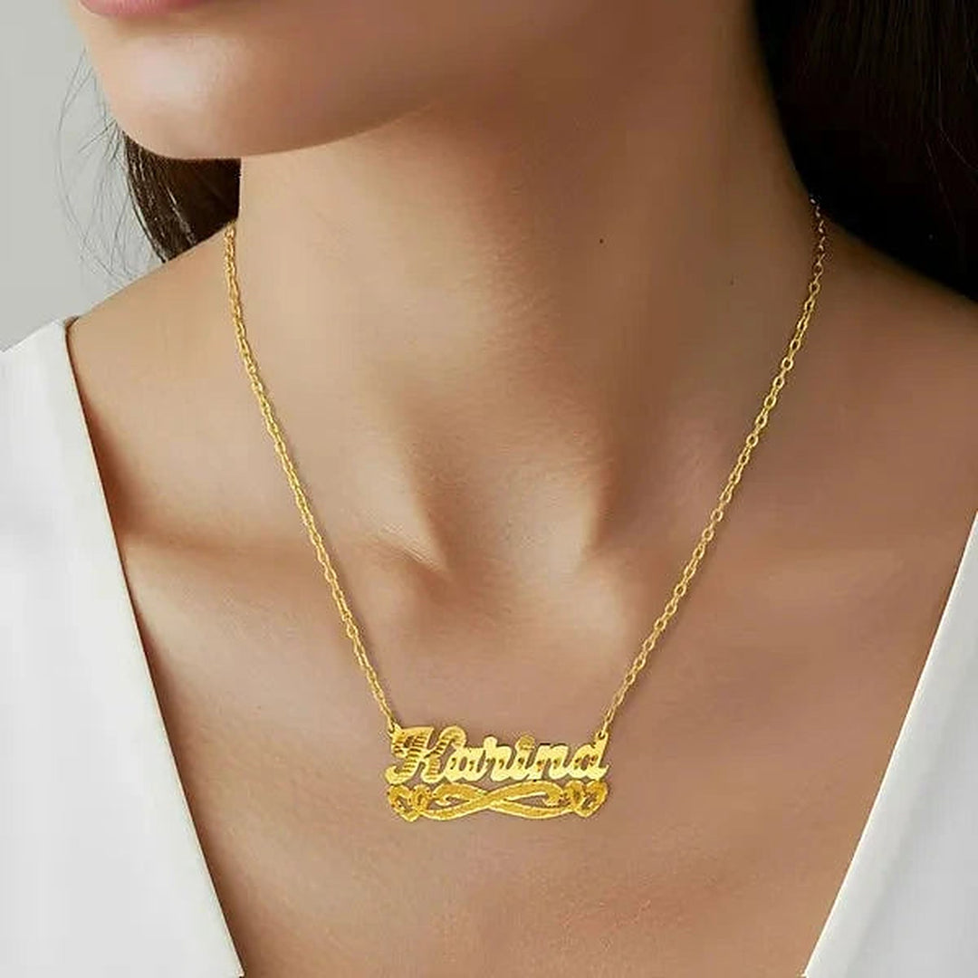 Model wearing the 14 Karat Diamond Cut & Florentine Name Necklace with Hearts in 14K yellow gold, name Karina | AJ's Jewelry