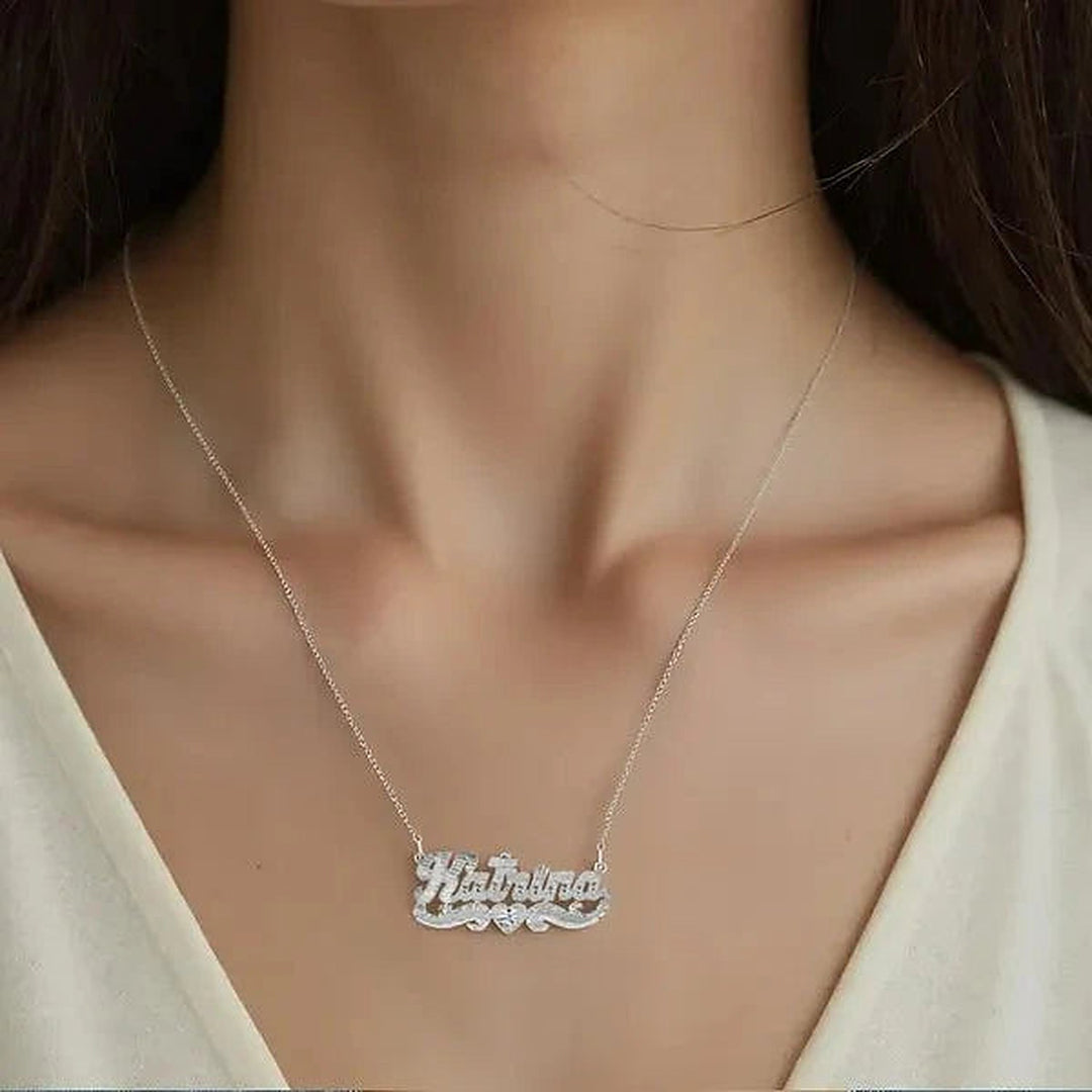 Model wearing the 14 Karat Diamond Cut & Florentine Name Necklace in 14K white gold, name Katrina | AJ's Jewelry