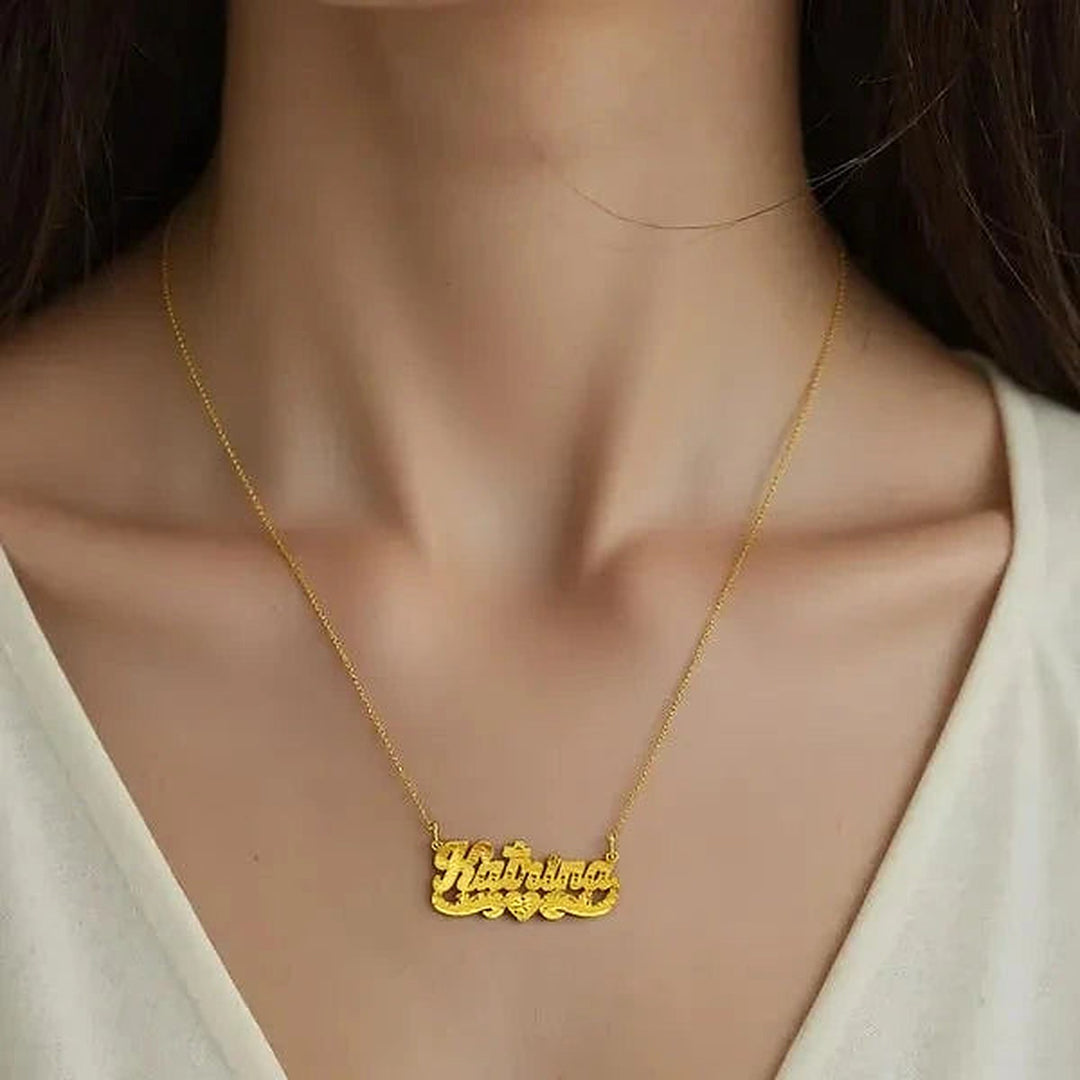 Model wearing the 14 Karat Diamond Cut & Florentine Name Necklace in 14K yellow gold, name Katrina | AJ's Jewelry