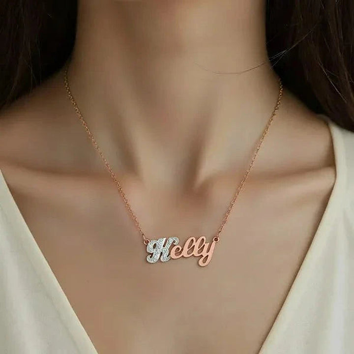 Model wearing the 14 Karat Small Name Necklace in 14K rose gold personalized with the name Kelly | AJ's Jewelry