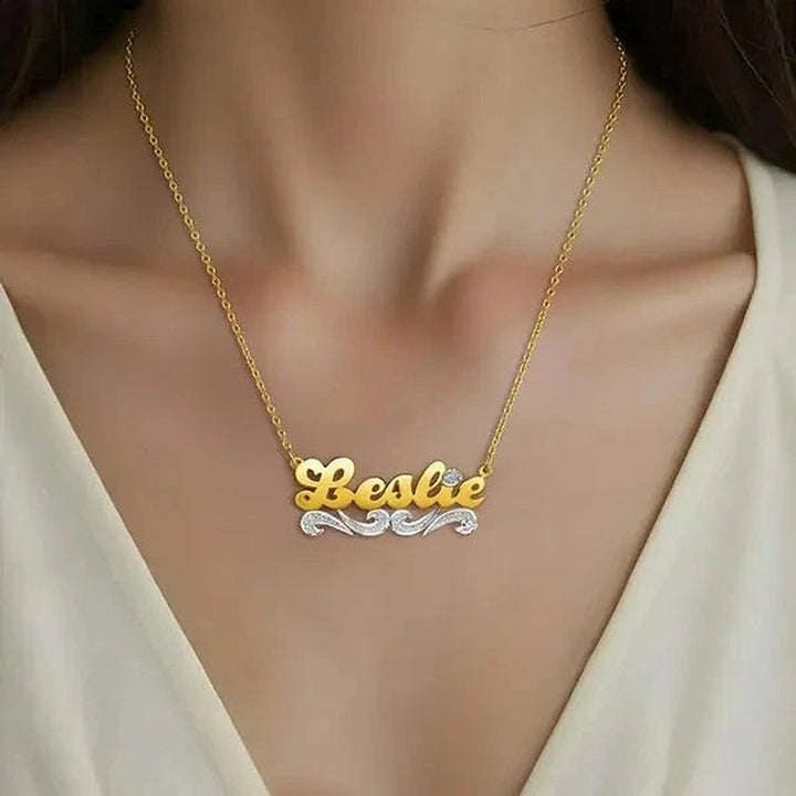 Model wearing the 14 Karat Script Name Necklace with Tail in 14K yellow gold personalized with the name Leslie | AJ's Jewelry