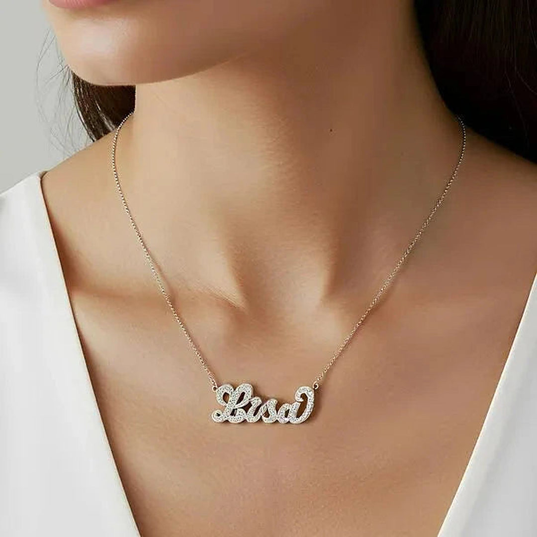 Model wearing the 14 Karat Diamond Cut 3D Name Necklace in 14K white gold personalized with the name Lisa | AJ's Jewelry