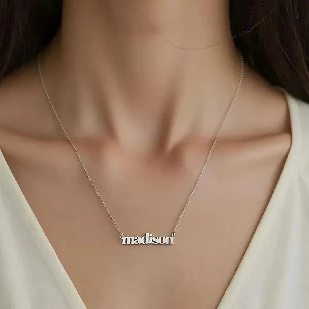 Model wearing the Sterling Silver Lowercase Bold Name Necklace personalized with the name Madison | AJ's Jewelry