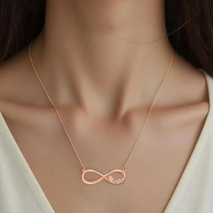 Model wearing the 14 Karat Infinity Name Necklace in 14K rose gold personalized with the name Maria | AJ's Jewelry