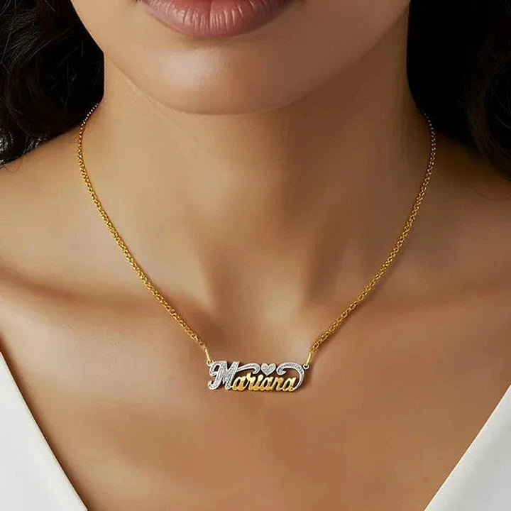Model wearing the 14 Karat Small Name Necklace with Heart in 14K yellow gold personalized with the name Mariana | AJ's Jewelry