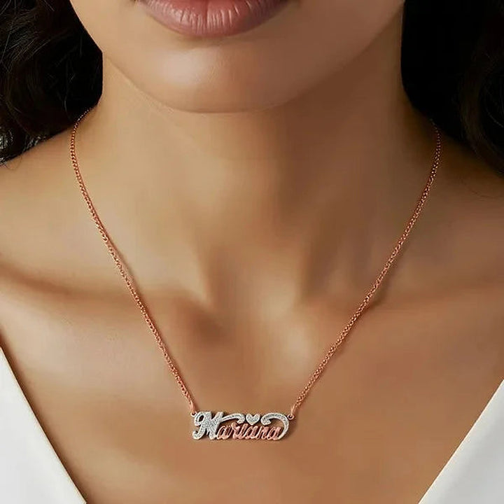Model wearing the 14 Karat Small Name Necklace with Heart in 14K rose gold personalized with the name Marina | AJ's Jewelry