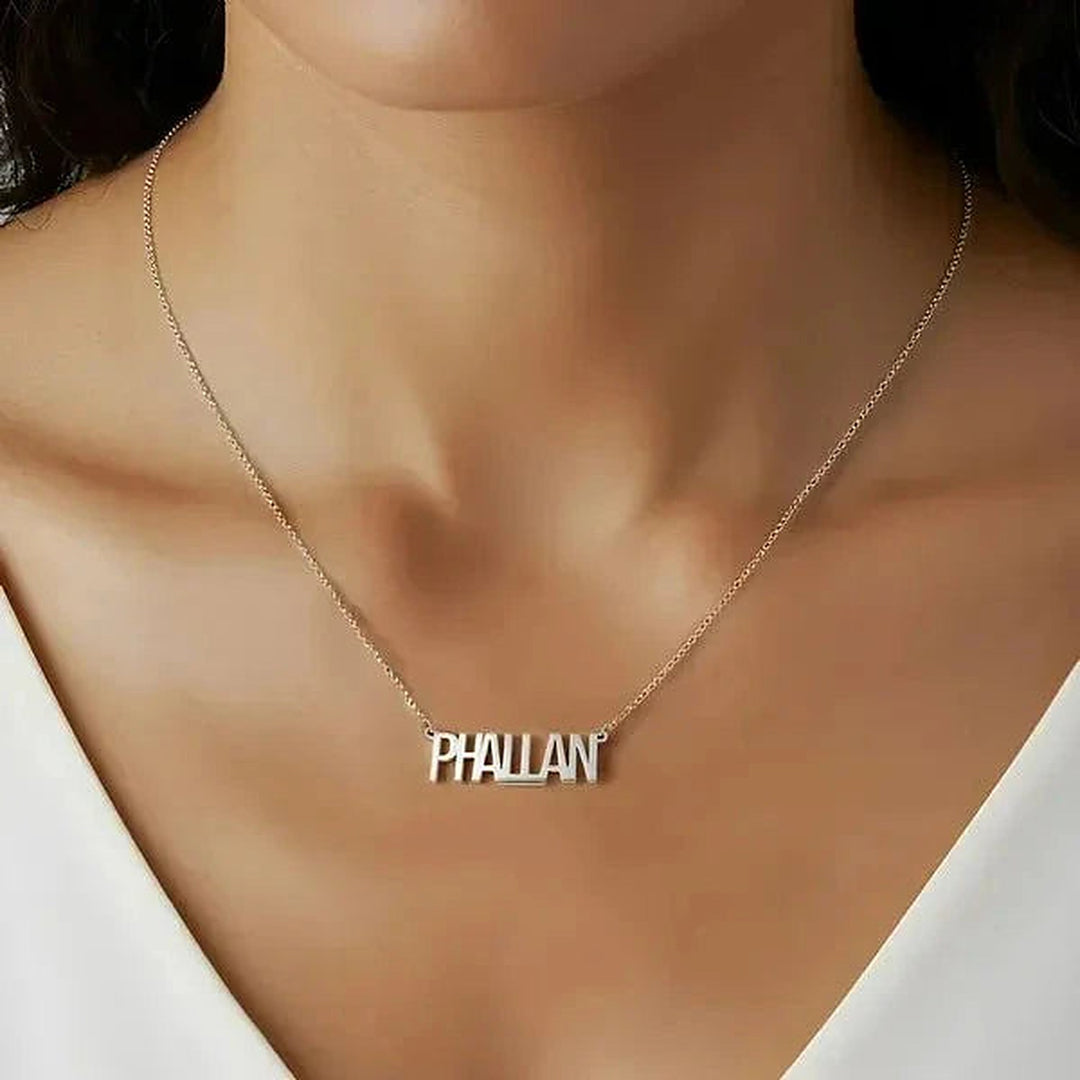 Model wearing the Sterling Silver Thin Letter Name Necklace personalized with the name Phallan | AJ's Jewelry