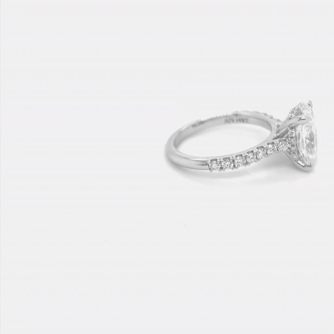 Rotating video of the 14 Karat White Gold elongated cushion lab grown diamond hidden halo engagement ring at AJ's Jewelry in Queens, NY