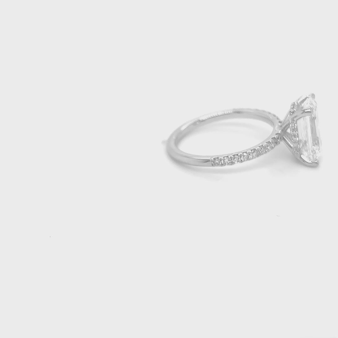 Rotating video of the 14 Karat Gold 3.5ct emerald cut lab grown diamond hidden halo engagement ring at AJ's Jewelry in Queens, NY