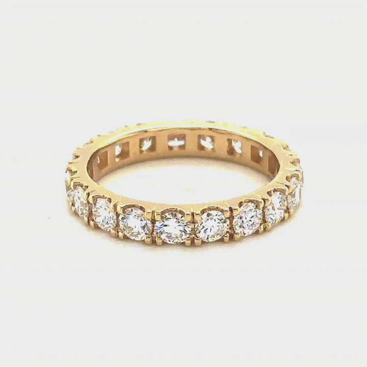 Rotating video of the 14 Karat yellow gold lab grown diamond eternity band at AJ's Jewelry in Queens, NY
