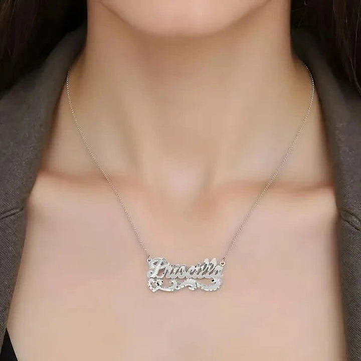 Model wearing the 14 Karat Diamond Cut Name Necklace in 14K white gold personalized with the name Priscilla | AJ's Jewelry