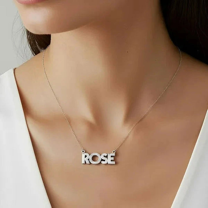 Model wearing the Sterling Silver Fluted Name Necklace in rose gold personalized with the name Rose | AJ's Jewelry