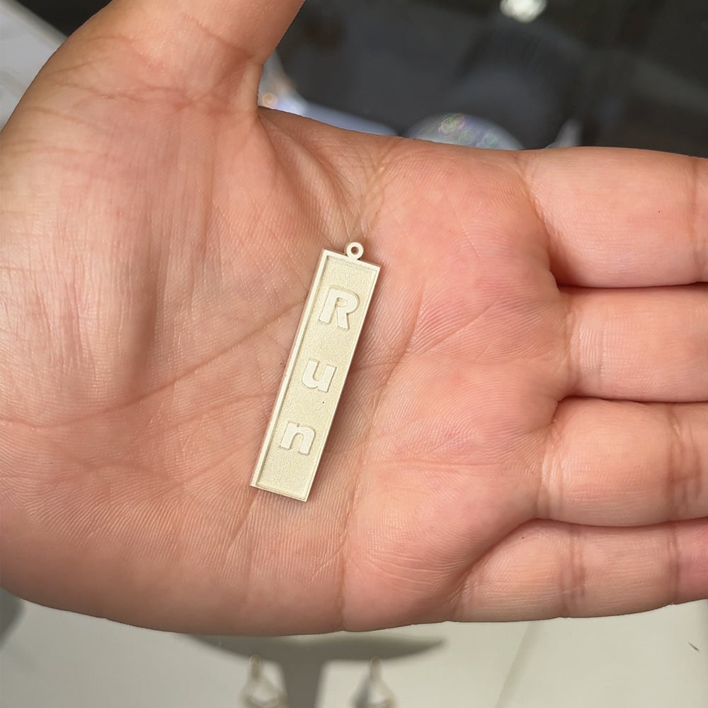 Sterling silver marathon run bar pendant after laser engraving and cutting, before hand finishing at AJ's Jewelry Queens NY