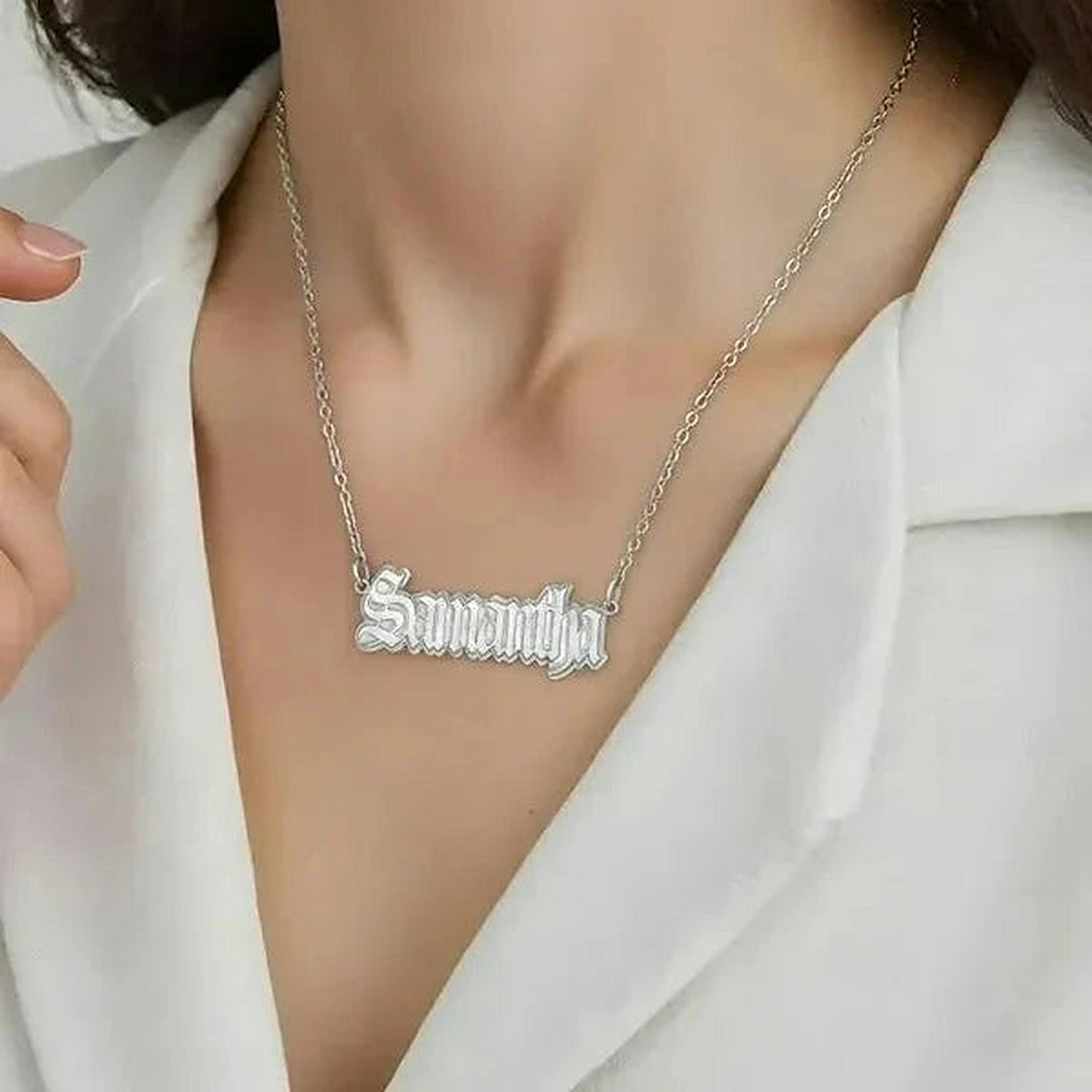 Model wearing the 14 Karat Gothic Style Name Necklace in 14K white gold personalized with the name Samantha | AJ's Jewelry