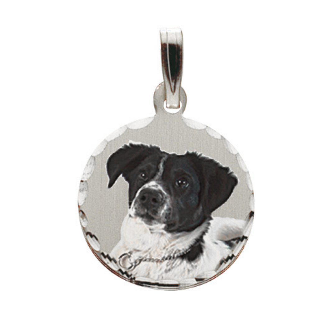 A round silver pendant charm featuring a black and white dog portrait, shown on a plain white background.