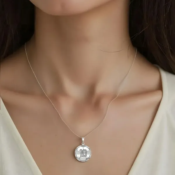 White Gold Personalized Soccer Ball Pendant on a female model