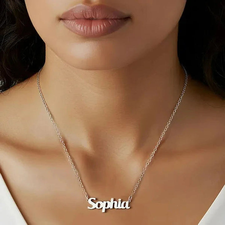 Model wearing the 14 Karat Bold Print Name Necklace in 14K white gold personalized with the name Sophia | AJ's Jewelry