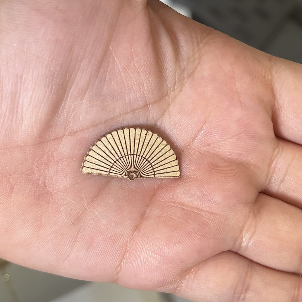 14kt yellow gold Spanish fan pendant after laser engraving and cutting, before hand finishing at AJ's Jewelry Queens NY
