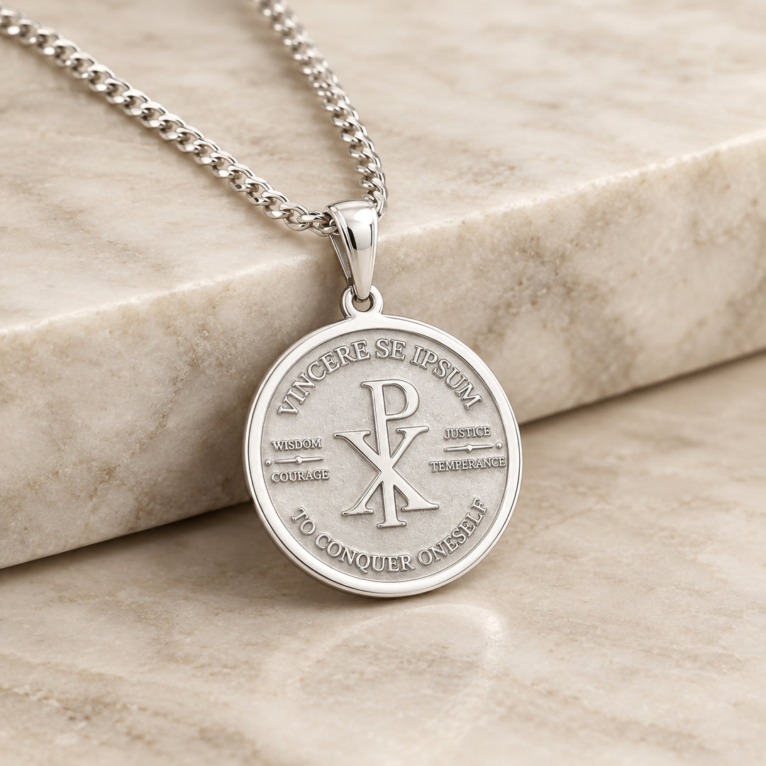 Finished sterling silver custom religious pendant with engraved Chi Rho, hanging on its chain
