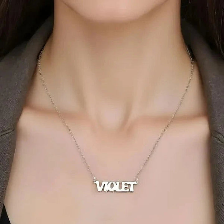 Model wearing the Sterling Silver Retro Letter Style Name Necklace personalized with the name Violet | AJ's Jewelry