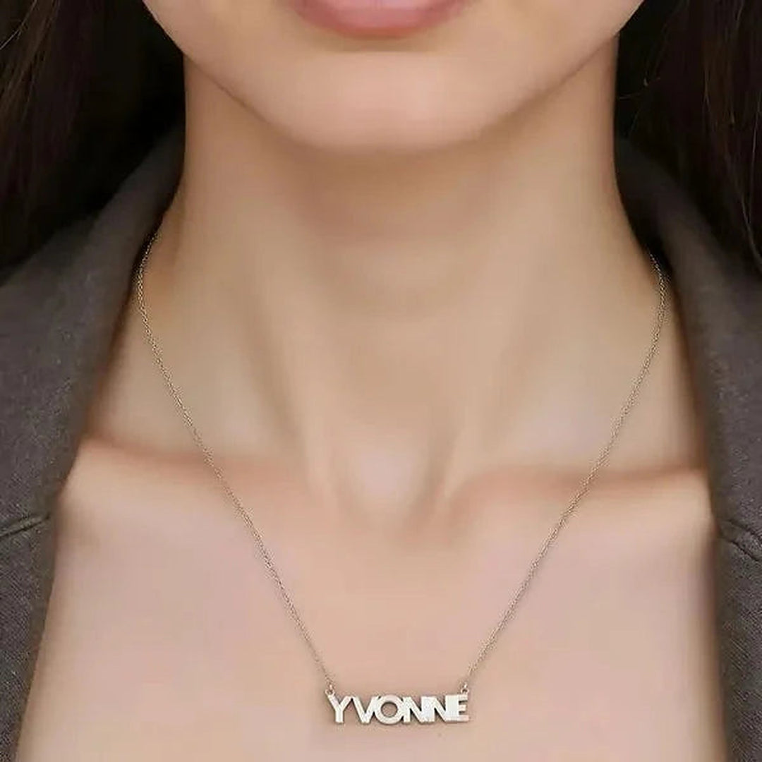 Model wearing the Sterling Silver Fluted Name Necklace personalized with the name Yvonne | AJ's Jewelry