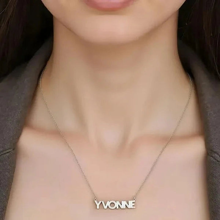 Model wearing the Sterling Silver Fluted Name Necklace personalized with the name Yvonne | AJ's Jewelry