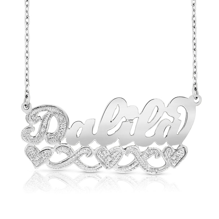 A Sample of the 14 Karat Name Necklace with Three Hearts with the name Dalila in White